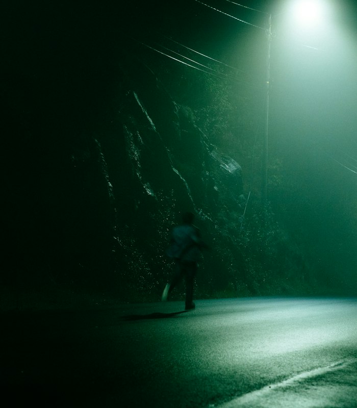 Runners on a city road at night
